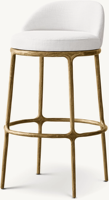 Tabouret de bar à hauteur de comptoir à quatre pieds avec cadre sculptural en laiton martelé, dossier semi-courbé et coussin en lin blanc