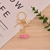 OEM Tascharms Roze Kersen Fruit 18K Goud Gegalvaniseerd Vlinderstrik Accessoire Vlekvrij Waterdicht Esthetische Mode Sieraden Cadeau