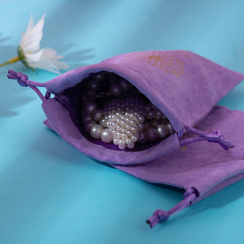 Five purple flat drawstrings