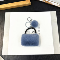 Mini sac à main de luxe en peluche douce avec pompon, breloque décorative en fausse fourrure, pendentif pour sac à dos, cadeau pour femme