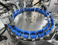 Machine automatique rotative de remplissage et de scellage de flacons de parfum et de liquides parfumés sous vide