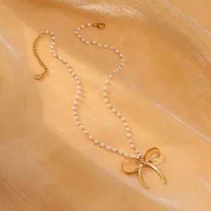 2024 INS Offre Spéciale femmes en acier inoxydable noeud papillon pendentif collier avec chaîne de perles à la main étanche nœud papillon cadeaux mariages