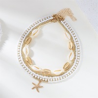 Collier multicouche tendance style vacances en bord de mer avec étoile de mer, coquillage et perle
