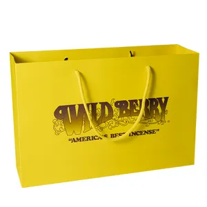 حقيبة ورقية للتسوق هدية فاخرة صفراء بالجملة بشعار لتعبئة وتغليف الملابس مخصصة