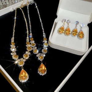 Ensemble de bijoux pour femmes pour dîner de gala, collier et boucles d'oreilles en zircon jaune en forme de goutte d'eau, de haute qualité - Product Image 1
