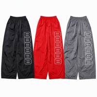 Pantalones Deportivos Personalizados Ligeros de Cintura Media y Pierna Ancha, Cortavientos de Nailon, Estilo Casual Atlético, Estampado B, Ropa Urbana Unisex al por Mayor