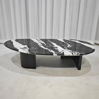 Table basse ovale en marbre noir et blanc avec base en acier inoxydable noir