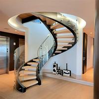 Escalier hélicoïdal courbé Tanlong avec balustrade en verre et poutre centrale en acier