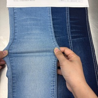 Tela vaquera elástica azul por delante y negra por detrás de 8.4oz de algodón, viscosa y spandex para shorts de mezclilla al por mayor