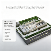 Maquette d'usine de parc industriel avec immeuble de bureaux, atelier, zone de stationnement, routes et ceinture verte