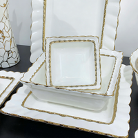 Service de table en céramique et porcelaine de luxe blanc avec bordure dorée, écologique et étanche, idéal pour les cadeaux de mariage, vente en gros