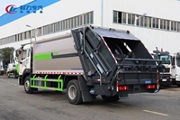 Camion compacteur de déchets diesel 4x2 robuste avec boîte de vitesses manuelle et chargement arrière automatique pour une collecte efficace des déchets communautaires