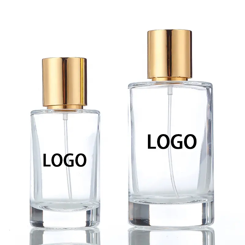 Bouteille de parfum vide en verre Oem transparent de cylindre de haute qualité 50ml 100ml avec pulvérisateur à pompe de boîte-cadeau