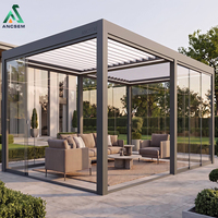 Pergola bioclimatique de luxe ANCSEM en aluminium avec murs en verre, toit à lames motorisées, salon extérieur de luxe