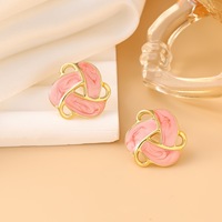 Pendientes de estilo palaciego retro, geométricos triangulares con esmalte de goteo, de moda, con diseño de flor hueca giratoria, al por mayor
