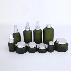 Botellas y frascos de vidrio para cosméticos de color verde oliva reciclables con hombro inclinado de diseño único con tapa de aluminio mental para el cuidado de la piel