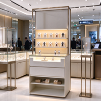 Vitrine d'exposition de montres avec cadre doré, éclairage LED, supports en acrylique, tiroirs et étagère ouverte, certifiée CE ETL, pour les boutiques de montres