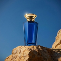 Nouvelle conception de flacon de parfum en verre à col cranté de forme unique, 100 ml, ambre bleu, flacon de parfum vide avec vaporisateur à fine brume