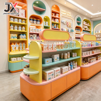 Ensemble complet de mobilier de magasin pour bébés sur mesure, design clé en main, avec armoire arquée colorée, présentoir et comptoir de vente pour produits pour bébés OEM