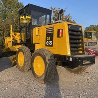 Niveleuse à moteur KOMATSU GD655 d'occasion, 17 tonnes, engin de construction avec moteur pour le nivellement des routes