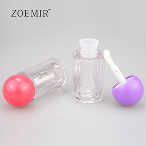 Tubos de brillo labial transparentes con tapa esférica roja y morada, botellas vacías de aceite labial, tubos redondos de plástico giratorios para lápiz labial líquido con tapón. - Product Image 1