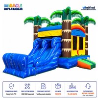 Structure gonflable combinée palmier tropical avec double toboggan et trampoline, pour usage sec ou aquatique, idéale pour les fêtes en extérieur et la location commerciale
