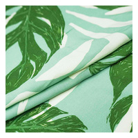 Tela de viscosa tejida con motivos de hojas tropicales, tela suave y fluida para blusas y faldas de verano, tela de rayón estampada con hojas al por mayor.