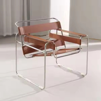 Fauteuil design du milieu du siècle, structure en acier inoxydable, fauteuil en cuir de vachette blanc, chaise de relaxation décontractée