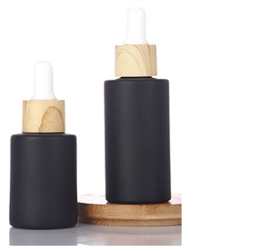 Botella de Perfume de <span class=keywords><strong>Vidrio</strong></span> Mate Negro <span class=keywords><strong>con</strong></span> Tapa de <span class=keywords><strong>Madera</strong></span>, Gotero de Goma, Etiquetas Personalizables y Tapa de Rosca para Fragancias Caseras - Product Image 1