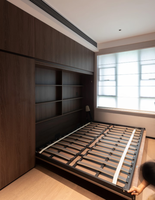 Lit Murphy moderne multifonctionnel en acier avec armoire intégrée et bureau, offrant un grand espace de rangement pour les espaces de vie compacts
