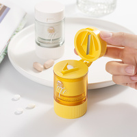 Mini coupe-pilule en plastique séparateur coupe-pilule boîte à pilules en plastique ronde avec coupe