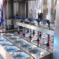 Machine de remplissage et de scellage pneumatique entièrement automatique pour gobelets et canettes en plastique et en aluminium