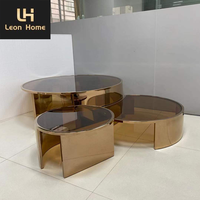 Table basse de luxe minimaliste en verre transparent ronde et moderne pieds en acier inoxydable