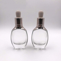 Flacon compte-gouttes en verre de luxe, emballage cosmétique pour soins de la peau, récipient en verre avec compte-gouttes à manchon d'épaule
