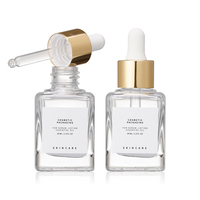 Flacon compte-gouttes carré en verre transparent à fond épais de 30 ml pour huiles essentielles et cosmétiques, avec marquage à chaud et logo personnalisé