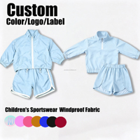 Ensemble deux pièces coupe-vent personnalisé pour enfants : veste courte à col montant et manches longues, et short de sport – Tenue décontractée pour enfants OEM