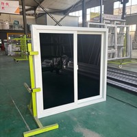 Komplett montiertes UPVC-Schiebefenster mit schwarzem Glas, Insektenschutz und integrierten Aluminium-Sicherheitsgittern