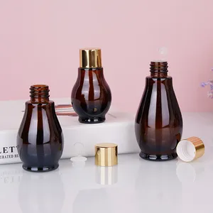 Droplet Shape Hair Oil Glass Bottle Brown Glass Essential Oil Bottle Amber Empty Glass Bottles With Aluminium Gold Cap