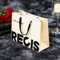 Sacs de shopping en papier noir et rose classiques personnalisés en gros avec logo imprimé et poignée en ruban pour boutique de vêtements, emballage en vrac