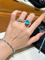 Bague de fiançailles en or 18 carats avec diamant de laboratoire bleu Paraiba taille ovale de luxe et bande pavée torsadée pour femme