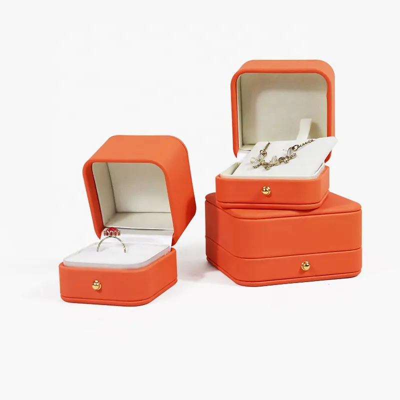สินค้ายอดนิยม สีส้ม คุณภาพสูง หนัง แฟชั่น กล่องเครื่องประดับเข้ามุม กล่องแหวนพิมพ์โลโก้ฟรี