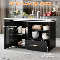 Chariot de rangement de cuisine noir sur roulettes avec plateau coulissant, étagères ouvertes, armoire vitrée, tiroir et îlot de service mobile