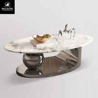 Table basse ovale de luxe en marbre de style européen et américain, avec support créatif en métal en forme de boule, pour salon moderne
