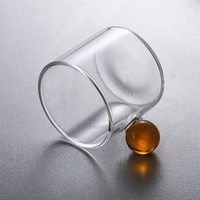 Tasse à café en verre soufflé à la main, résistante à la chaleur, de forme cylindrique, avec poignée en forme de boule colorée, design créatif et unique.