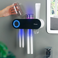 Support de rangement personnalisable pour salle de bain avec désinfecteur UV pour brosses à dents et dentifrice, et 2 gobelets