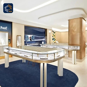 การออกแบบตกแต่งภายในร้านขายนาฬิกาและเครื่องประดับสุดหรู <span class=keywords><strong>ตู้</strong></span>โชว์กระจกโค้ง กรอบโลหะสีทอง พร้อมเคาน์เตอร์กลางรูปทรงเกาะ - Product Image 1