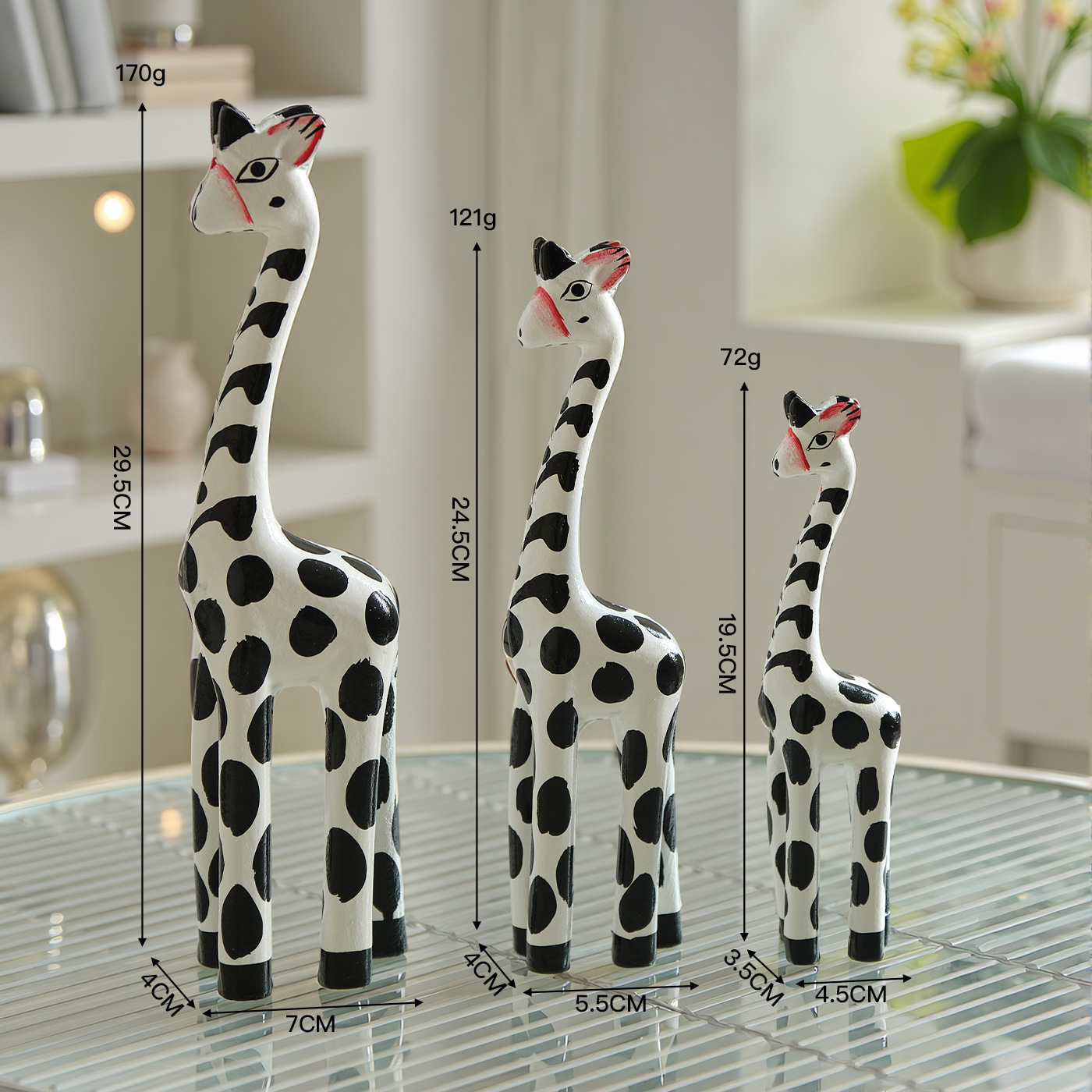 A set of white giraffe figurines