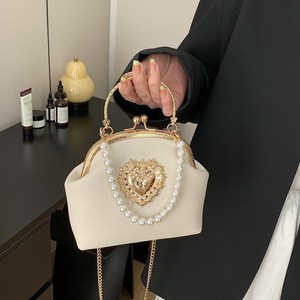 Vente en gros de sacs à main décontractés en cuir PU pour femmes sacs à bandoulière avec chaîne en forme de coquille perle - Product Image 1