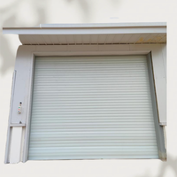 Porte à enroulement coupe-vent en acier de couleur personnalisée, renforcée, électrique, pour entrepôt extérieur et usine