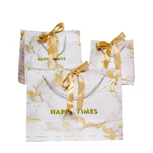 Bolsa de regalo de fiesta de cumpleaños y boda con cinta dorada Ins al por mayor, bolso de compras de papel para disfraz marmoleado con lazo elegante